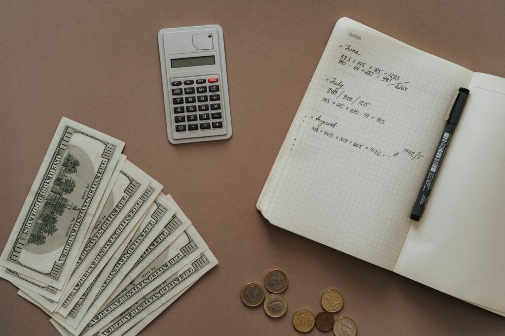 top view photo of notebook near money